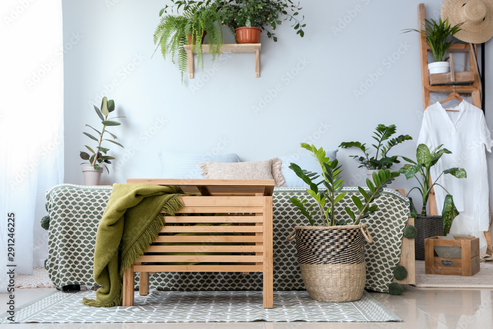 Interior of modern bedroom with houseplants
