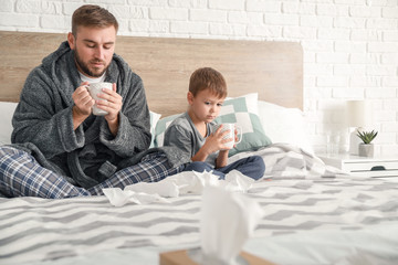 Poster - Father and his little son ill with flu at home