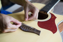 Change The Acoustic Guitar Strings, Step To Insert Guitar String Into The Hole, Close-up