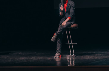 businessman, makes a report at a corporate meeting