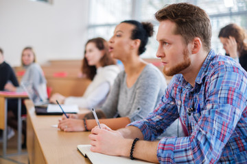 Wall Mural - Multinational group of students in an auditorium