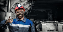 Portrait Working Young Male Miner In Red Cap Showing Thumbs Up, Excellent Sign Background Coal Mine. Industrial Concept