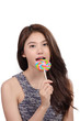 © chaiwat - portrait Young woman with candy on white background