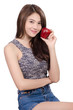 © chaiwat - Beautiful young woman is holding an apple and smiling.