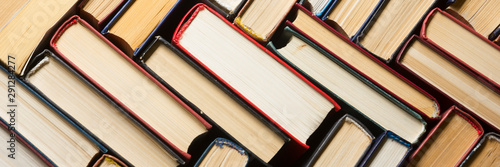 Fotografía Stack of books background. many books piles.