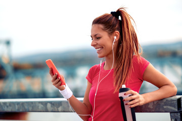 Wall Mural - Female runner jogging over the bridge