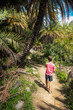 © bruno135_406 - Aspiring boy hiking amidst tropical trees on the island of Crete