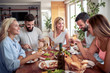 © ivanko80 - Group of happy friends eating home