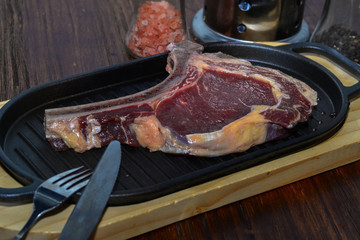 Wall Mural - A fresh steak on the chopping board