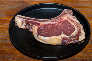 Wall Mural - A fresh steak on the chopping board