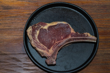 Wall Mural - A fresh steak on the chopping board