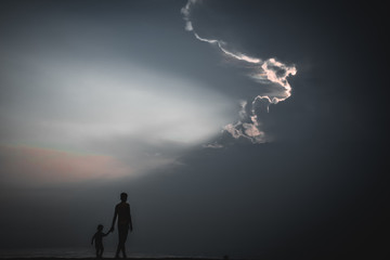 Wall Mural - silhouette of man on top of mountain