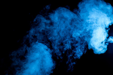 Blue billowing smoke on black background