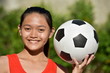 © dtiberio - Fitness Diverse Female Athlete Smiling With Soccer Ball