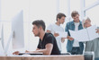 © ASDF - close up. a group of designers is working on a new project