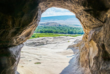 Framed View Of Valley From Inside Uplistsikhe Cave Town - Ancient Pre-christian Rock-hewn Town And Monastery In Georgia Eastern Europe
