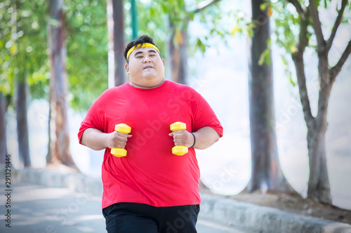 picture Fat Asian Man Running https stock adobe com images asian fat man running with dumbbells in the park 291329446 start checkout 1 content id 291329446