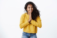 Pretty Please Help Me Out Asap. Cute African American Girl In Yellow Sweater Hold Hands In Pray, Smiling With Clingy Look, Begging For Favour, Asking Lend Car, Apologizing For Being Late
