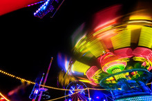 Abstract Colorful Funfair Carosuell In Neon Colors In Motion At A Fun Fair