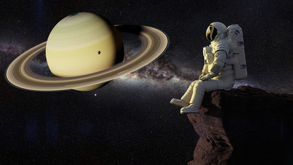 Wall Mural - astronaut sitting on a cliff on one of the moons of saturn