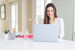 © Krakenimages.com - Young beautiful woman smiling happy and working using computer laptop