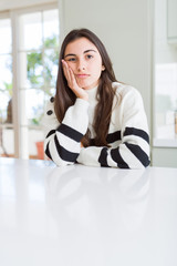 Canvas Print - Beautiful young woman wearing stripes sweater thinking looking tired and bored with depression problems with crossed arms.