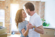 © Krakenimages.com - Middle age senior couple moving to a new house, dancing and smiling happy in love with apartmant