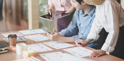 Wall Mural - cropped view of ui designer planing the ux application development with team members