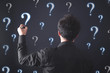© andranik123 - Businessman with question marks. Problem, Solution