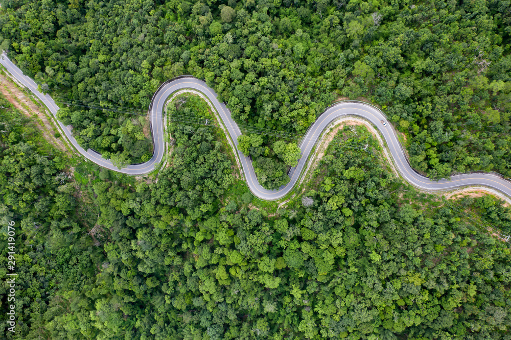 Drone view of curvng road . - obrazy, fototapety, plakaty 