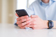© Krakenimages.com - Close up of business man working using smartphone