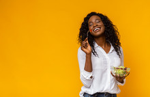 Happy African American Woman Enjoying Vegetable Salad