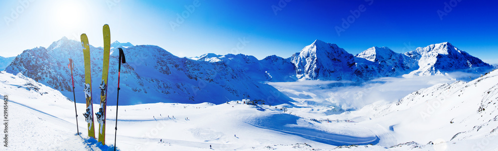 Ski in winter season, mountains and ski touring backcountry equipments on the top of snowy mountains in sunny day. South Tirol, Solda in Italy. - obrazy, fototapety, plakaty 