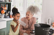 © ReeldealHD images - Grandmother recycling at home with granddaughter