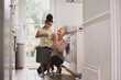 © ReeldealHD images - Grandmother recycling at home with granddaughter