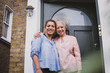 © ReeldealHD images - Portrait of senior female with daughter outside home