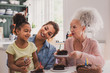 © ReeldealHD images - Three generations of family celebrating a birthday together