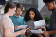 © ReeldealHD images - High school students opening their exam results
