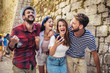 © Mediteraneo - Happy group of tourists traveling and sightseeing
