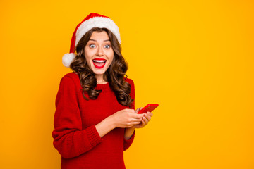 Sticker - Photo of crazy lady holding telephone in hands wear knitted pullover and santa hat isolated yellow background