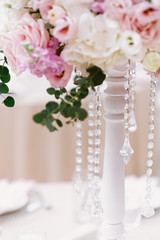 Poster - The lens chains complement the flower composition on the wedding table