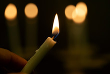 Close Up Hands  Lighting Candle Vigil In Darkness.Concept Of Light Of Hope., Worship, Prayer.soft Focus