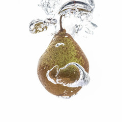 Beautiful fresh pear in water bubble white background.