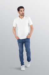 Wall Mural - Male model wearing white plain polo t shirt in blue denim jeans pant. Isolated background