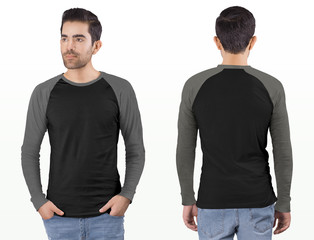 Wall Mural - Front and rear view of standing male model wearing black and grey long sleeve raglan shirt in ripped blue denim jeans pant. Isolated background.