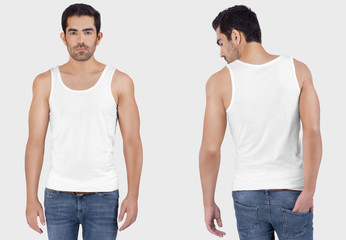 Wall Mural - Front back view of young male model wearing white plain white tank top shirt in blue denim jeans pant. Isolated background