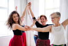 Group Of Senior People In Dancing Class With Dance Teacher.