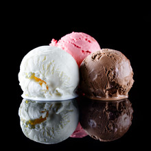 Ice Cream Scoop With Vanilla, Chocolate, Strawberry On Black Background