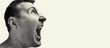 © svetazi - Concept of anger. Portrait of a screaming man on isolated background with free space. Black and white image.