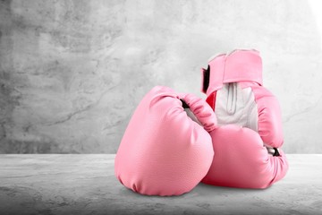 Wall Mural - Pink boxing gloves on background